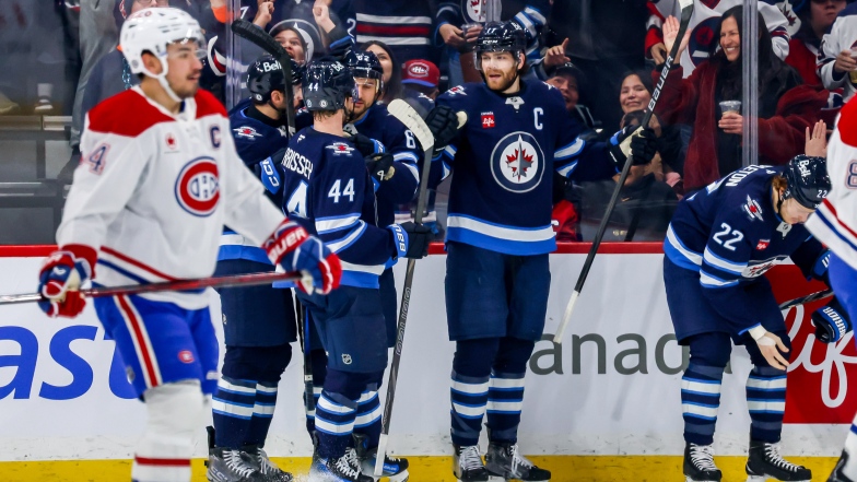 Dylan DeMelo, Josh Morrissey, Nino Niederreiter et Adam Lowry.