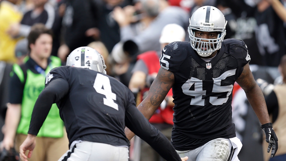 Derek Carr et Marcel Reece