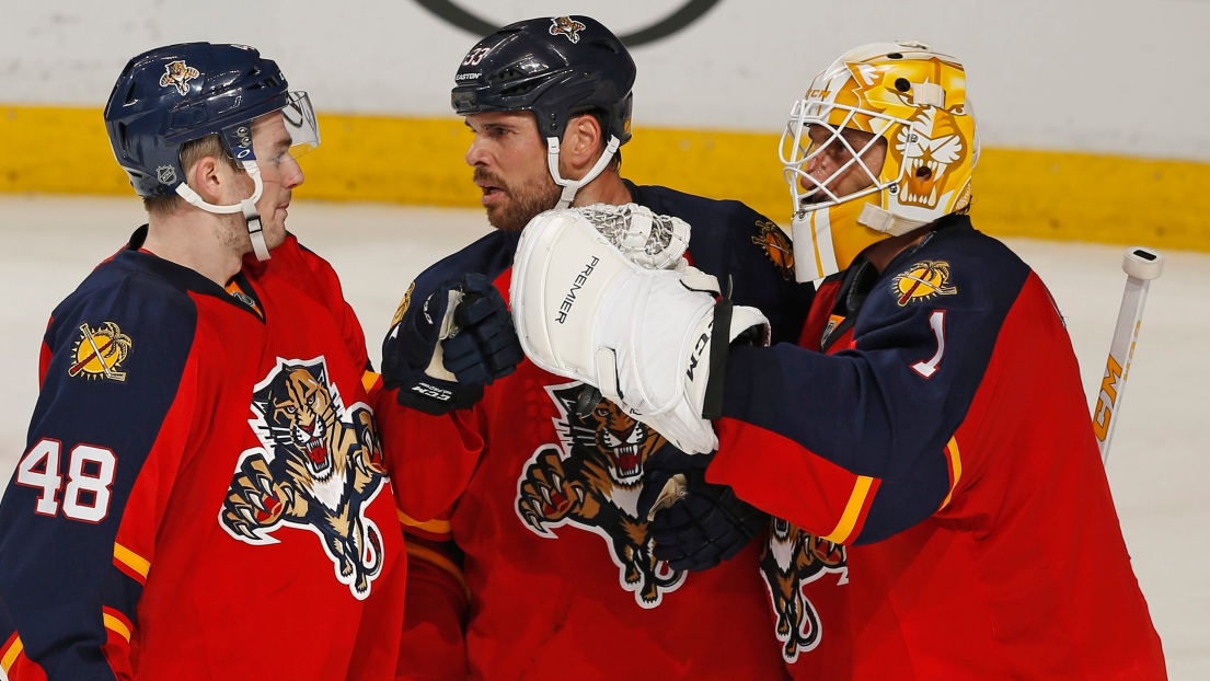 Roberto Luongo, Logan Shaw et Willie Mitchell