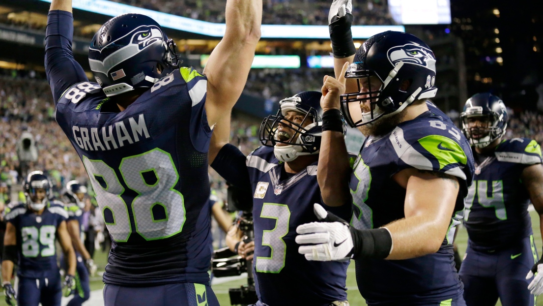 Jimmy Graham, Russell Wilson et Mark Glowinski